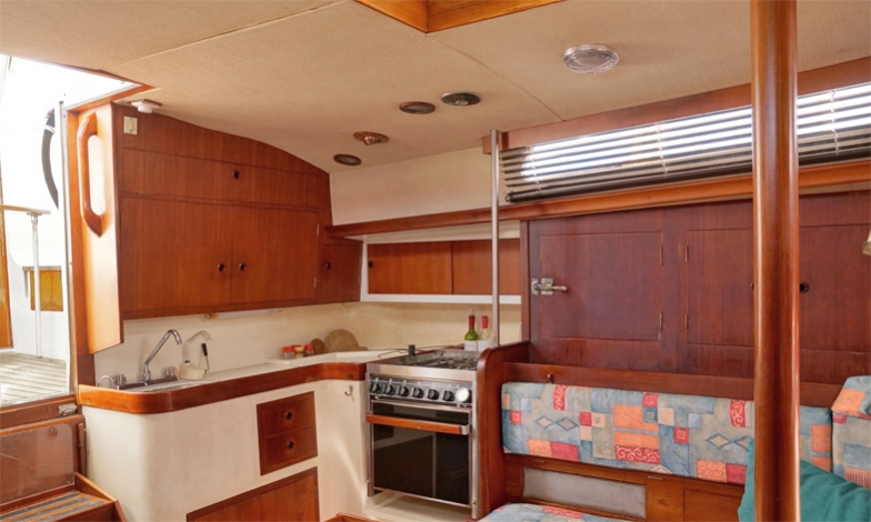 Galley, adjacent to the 2 step companionway, well ventilated, everything in reach